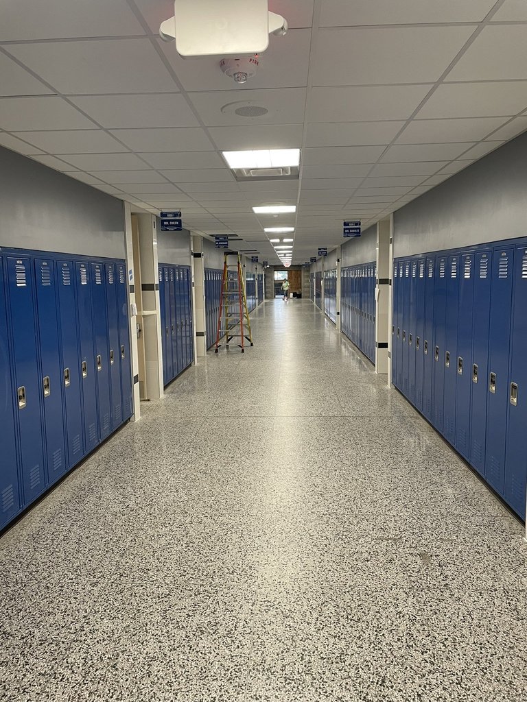 new hallway with blue lockers 