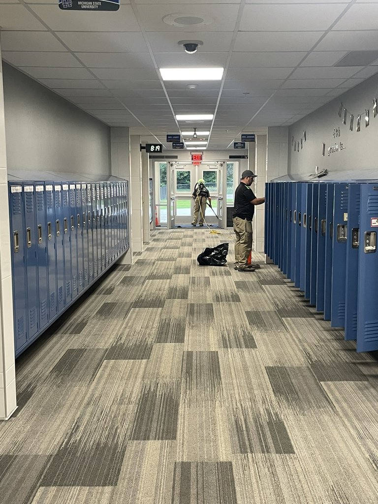 new hallway with blue lockers 