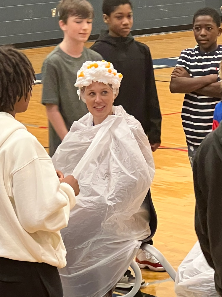 Mrs. Basse with shaving cream and cheese balls on her head